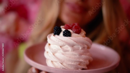 Beautiful girl drinks coffee with dessert in a cafe. advertising space