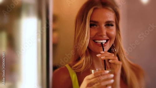 Beautiful girl drinks coffee with dessert in a cafe. advertising space