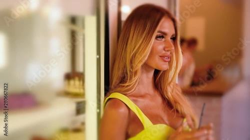 Beautiful girl drinks coffee with dessert in a cafe. advertising space