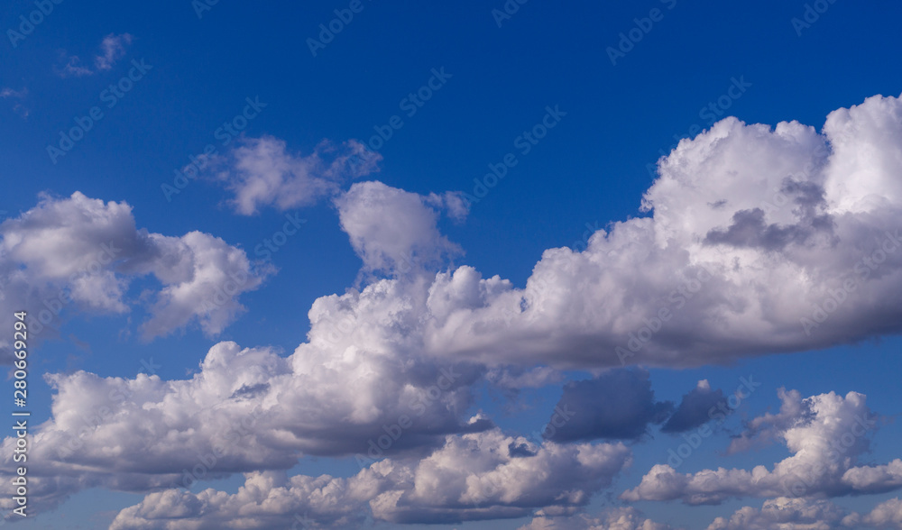 Fototapeta premium blue sky with white and gray clouds; cumulus. background; nature