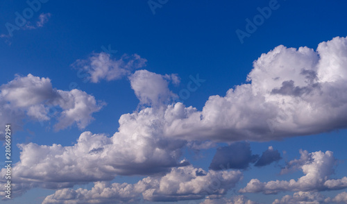 blue sky with white and gray clouds; cumulus. background; nature