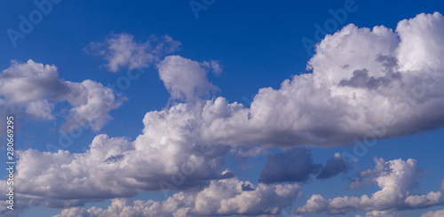 blue sky with white and gray clouds; cumulus. background; nature