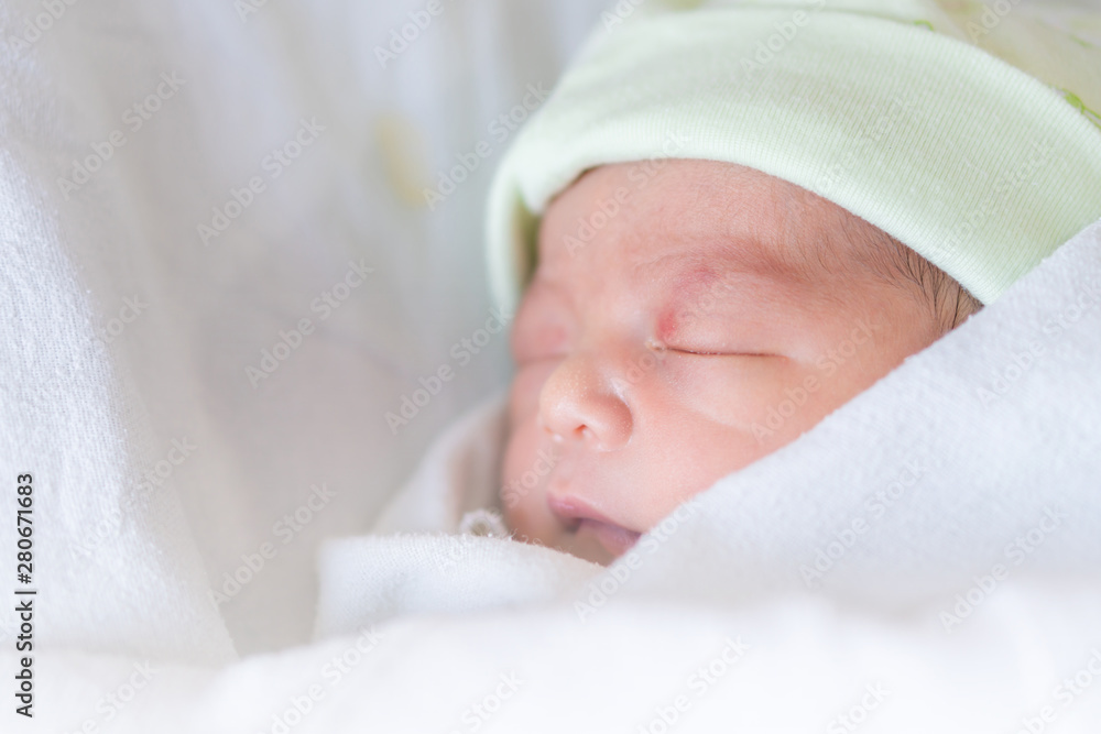 Selective focus of asian newborn baby boy sleeping at hospital Selective focus of asian newborn baby boy sleeping at hospital