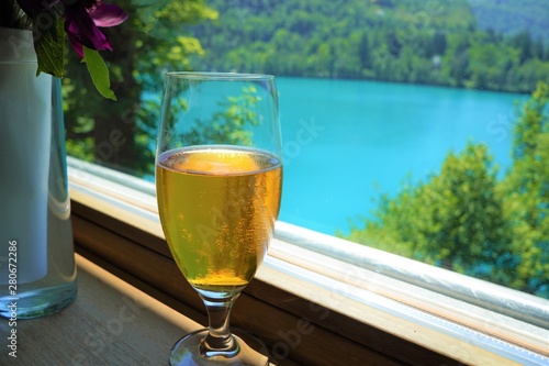A glass of beer by the Lake Bled