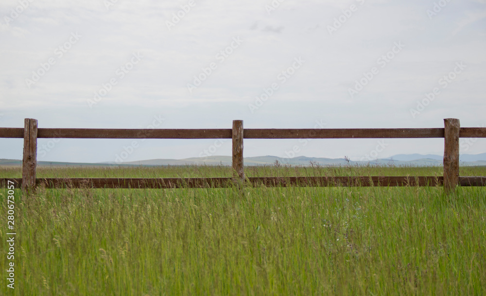 wooden fence in the field in daylight