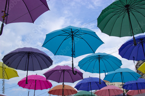 Colorful umbrellas background. Colorful umbrellas in the sky. Street decoration.