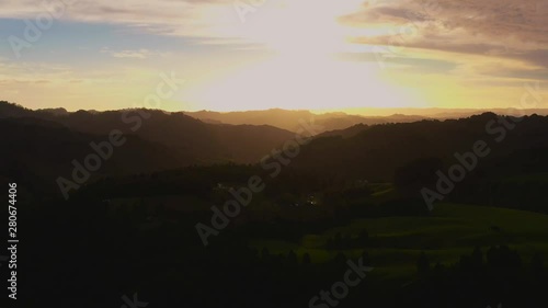 Wallpaper Mural Aerial still shot of dark hills with the sunset in the background Torontodigital.ca
