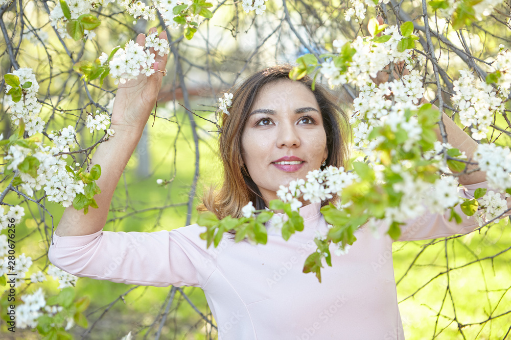 girl with flowers. gorgeous model in the spring garden. the girl near the tree in the spring. girl with flowers. gorgeous model in the spring garden. the girl near the tree in the spring.