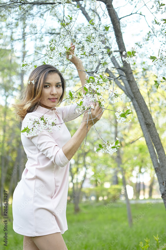 girl with flowers. gorgeous model in the spring garden. the girl near the tree in the spring. girl with flowers. gorgeous model in the spring garden. the girl near the tree in the spring.