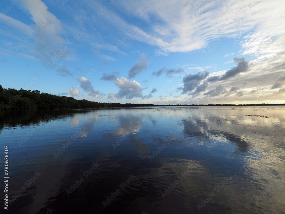 Obraz premium Sunset cloudscape and reflections on Coot Bay in Everglades National Park, Florida on a calm winter evening.