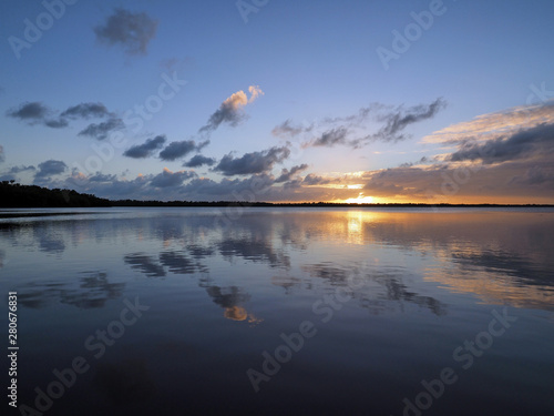 Sunset cloudscape and reflections on Coot Bay in Everglades National Park, Florida on a calm winter evening.