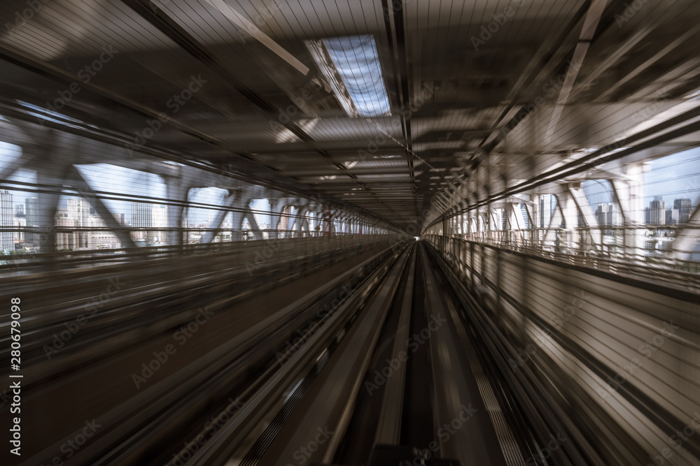 motion-blurred view from a moving train running in tunnel