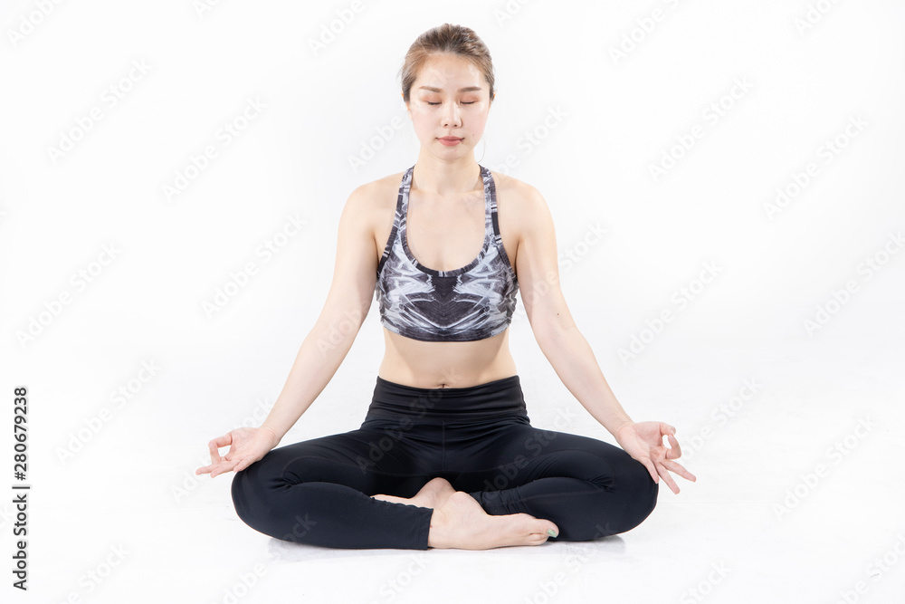 Sporty Asian young woman doing yoga practice isolated on white background. Sporty Asian young woman doing yoga practice isolated on white background.