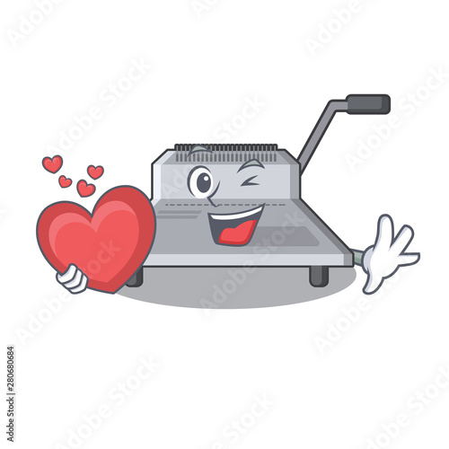 With heart binding machine above wood table cartoon