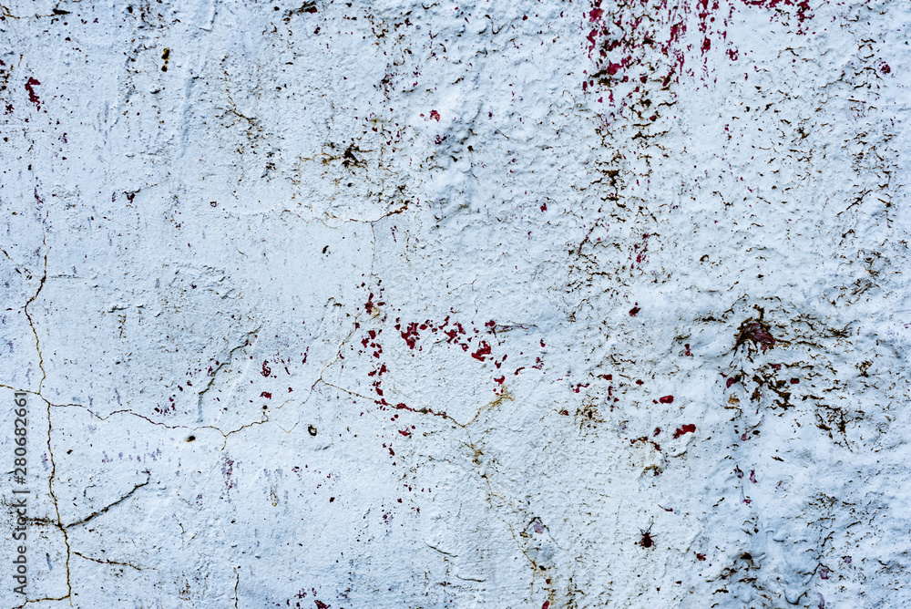 Fototapeta premium Texture of a concrete wall with cracks and scratches which can be used as a background