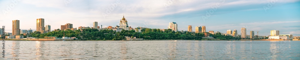View of the city of Khabarovsk from the Amur river. Urban landscape in the evening at sunset.