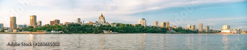 View of the city of Khabarovsk from the Amur river. Urban landscape in the evening at sunset. © rdv27