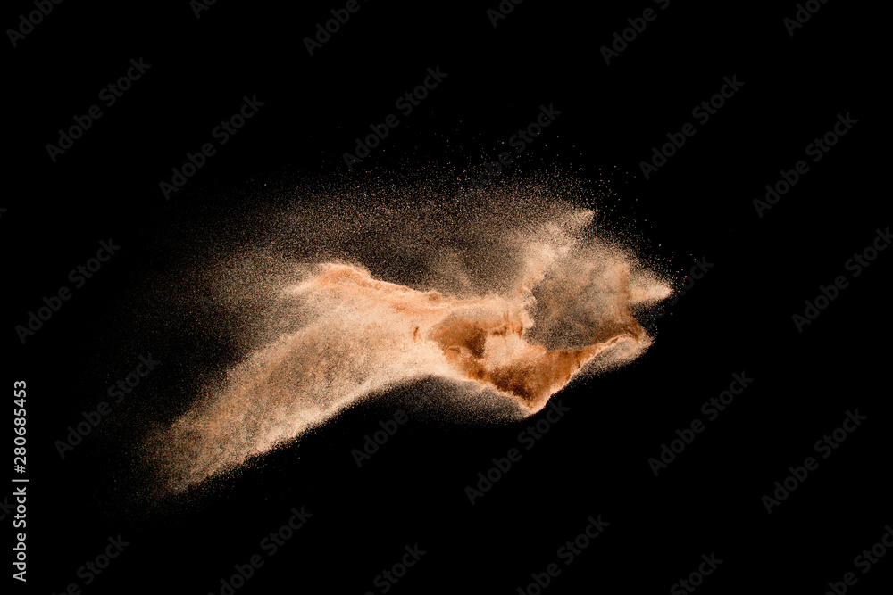 Dry river sand explosion isolated on black background. Abstract sand cloud.Brown colored sand splash against dark background. - obrazy, fototapety, plakaty 