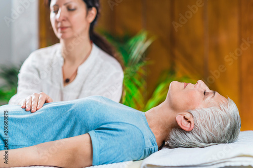 Marma Therapy. Ayurveda Stomach Treatment (Nabhi marma) photo