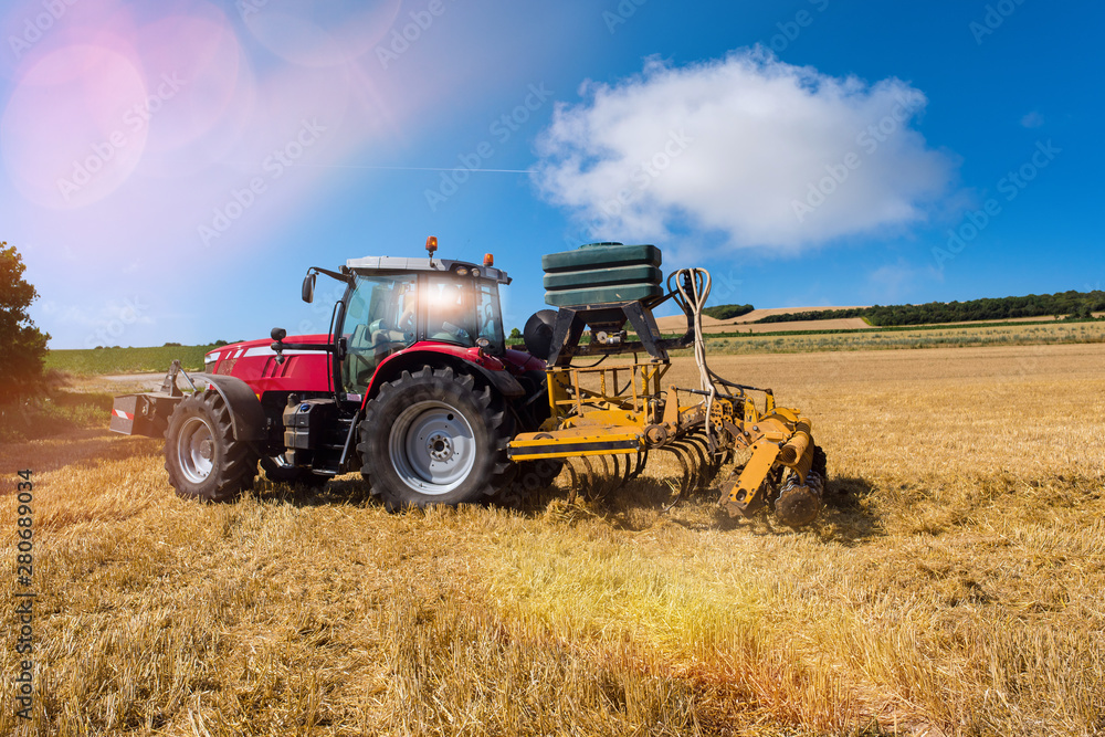 farmer plowing fields after summer grain harvest farmer plowing fields after summer grain harvest