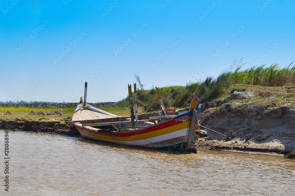 landscape image of a boat in river indus