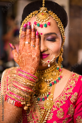 Photography Beautiful Asian Indian Bride Wearing Ethnic Traditional Outfit And heavy Gold Je