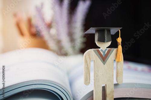 Education knowledge learning study abroad international Ideas. People Sign wood Graduation celebrating cap on textbook in library,Alternative studying distant for learn.Back to School in successful photo