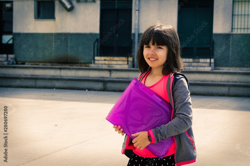 Fototapeta premium student with his backpack on his way to school or campus, back to school concept