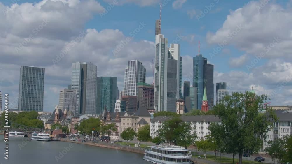 Flying through the streets of Frankfurt. Pan to the right of the skyline from the city. Flying through the streets of Frankfurt. Pan to the right of the skyline from the city.
