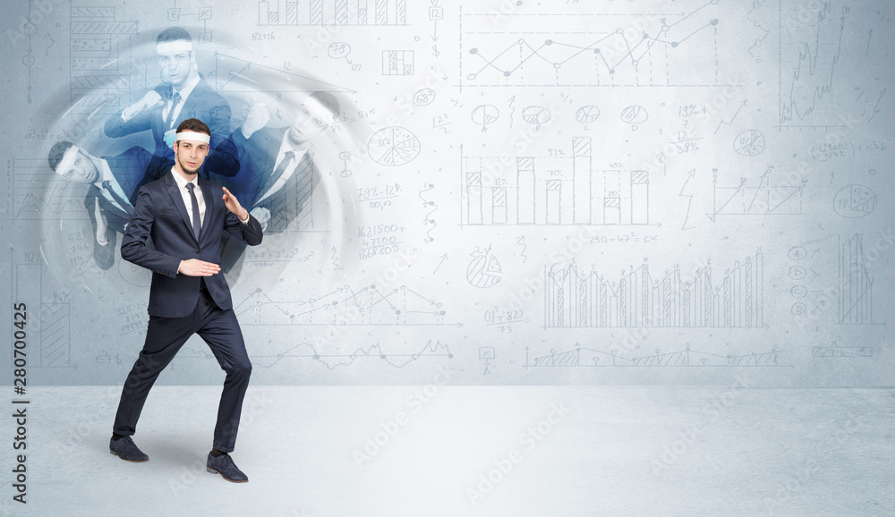 Young businessman in suit fighting with chart and report concept Young businessman in suit fighting with chart and report concept