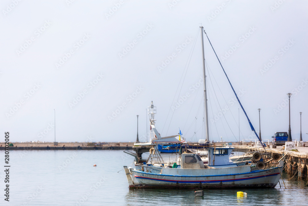 Fishing boats in small harbor , Halkidiki Greece
