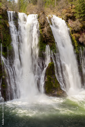 Close up of Burney Falls waterfall with Rainbow near Redding  in California