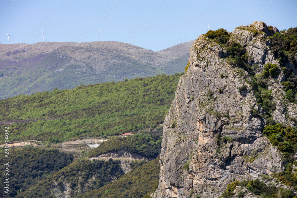 Vertical rock on a mountain with forest, Greece Vertical rock on a mountain with forest, Greece
