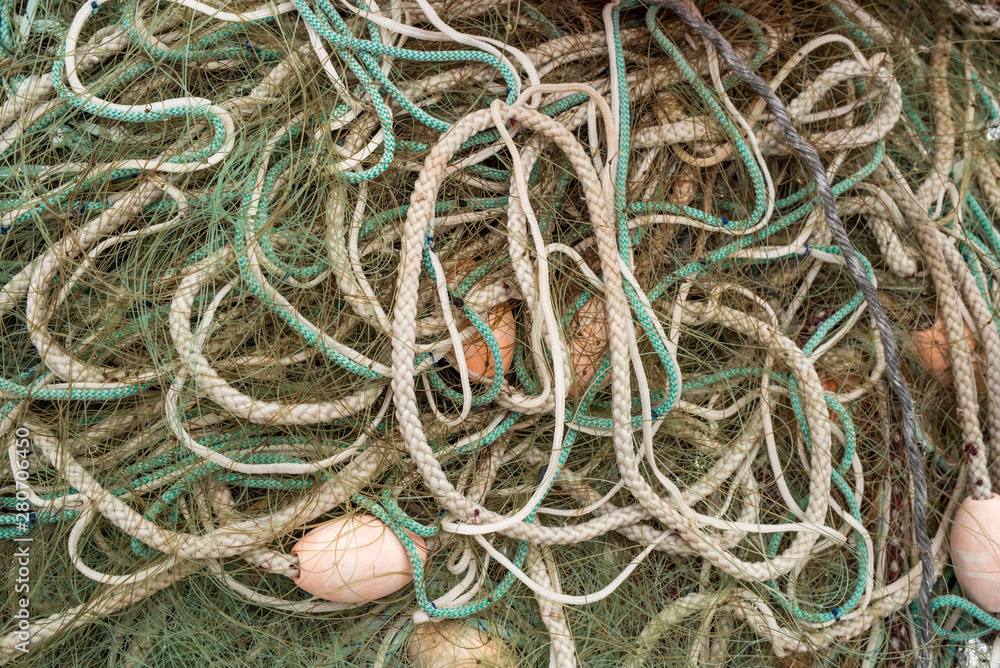 Entangled abstrackt background of different fishing nets and floats. Close up Entangled abstrackt background of different fishing nets and floats. Close up