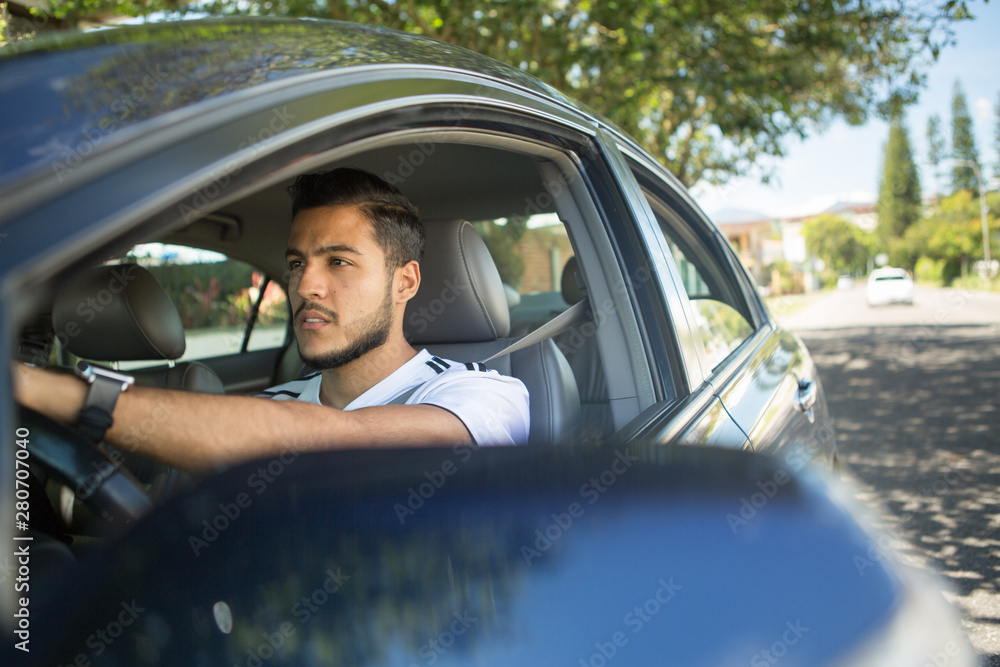 Young man driving his car