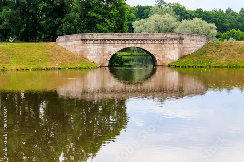 Wallpaper Mural Stone arch bridge across a lake in Gatchina, Russia Torontodigital.ca