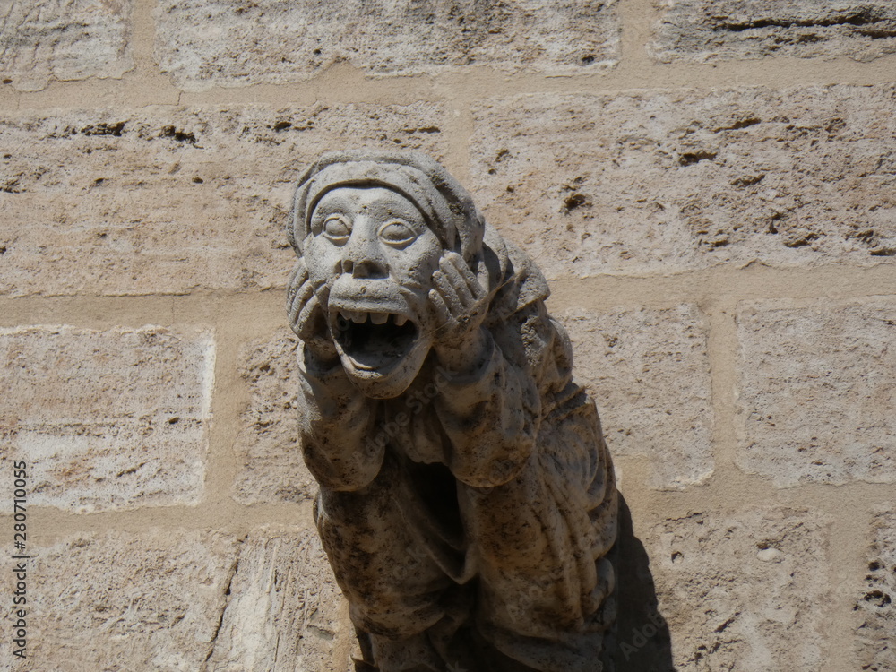 Ancient sculpture on the gate in Valencia