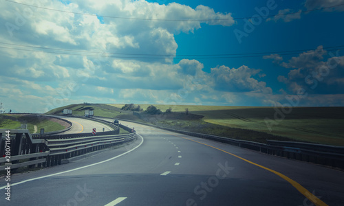 Russian asphalt roads. Highway. Road trip. The car goes on the road. Background asphalt road. © alenka2194