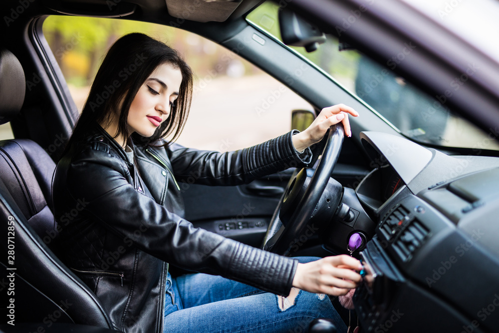 Young pretty woman change speed holding hand on gearbox in the car Young pretty woman change speed holding hand on gearbox in the car