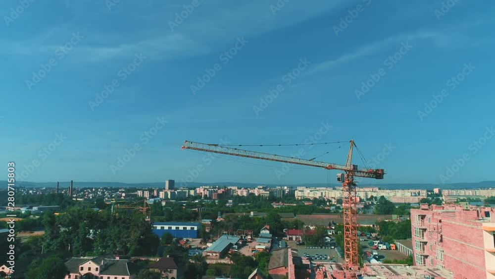 Aerial view of construction site of new residential building with tower crane. 4K. Aerial view of construction site of new residential building with tower crane. 4K.