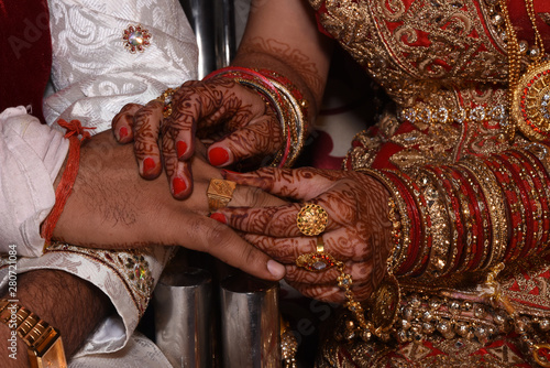 Hands holding together bride and groom before marriage.