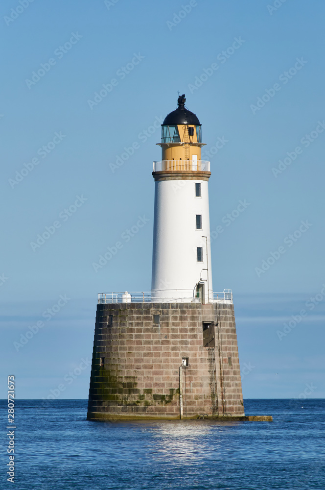 Rattray Head Lighthouse just off Rattray Point in Aberdeenshire, Scotland, on one fine Summers Afternoon in calm conditions.