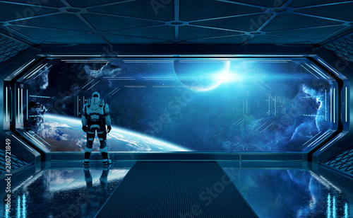 Fototapeta Naklejka Na Ścianę i Meble -  Astronaut in futuristic spaceship watching space through a large window 3d rendering elements of this image furnished by NASA