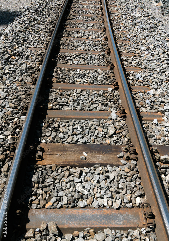 narrow gauge railroad tracks and rock bed close up view narrow gauge railroad tracks and rock bed close up view