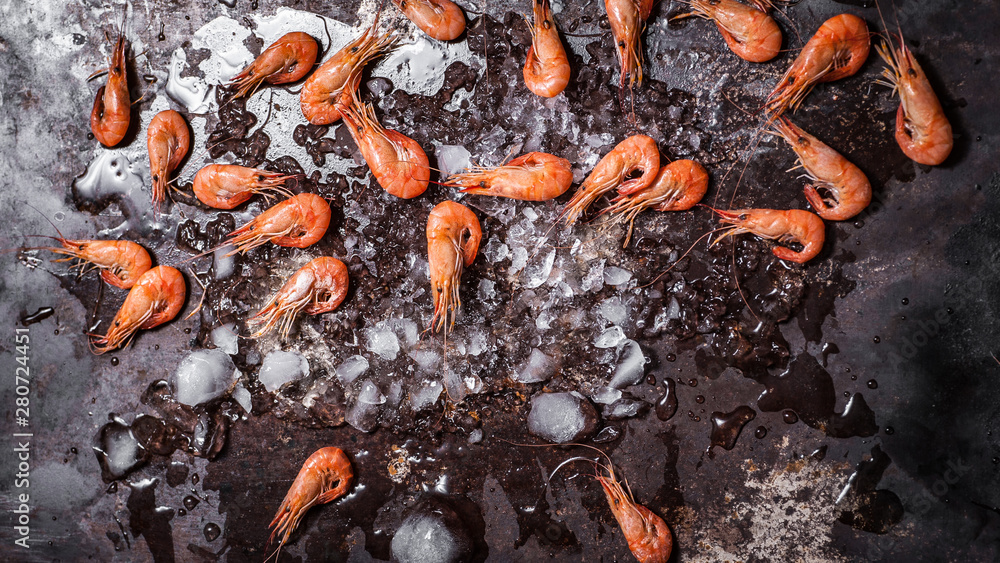 Shrimps Shrimp with crushed ice on dark grunge background. Top view Shrimps Shrimp with crushed ice on dark grunge background. Top view