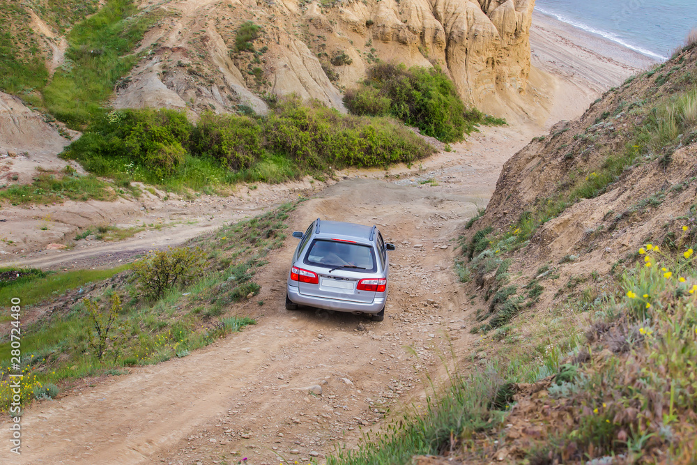 car goes down the mountain dirt road car goes down the mountain dirt road