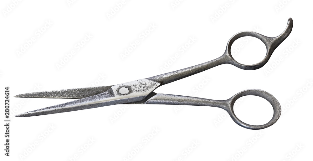 Old steel hairdressing scissors isolated on white background.Used by the German Army in the Second World War Old steel hairdressing scissors isolated on white background.Used by the German Army in the Second World War