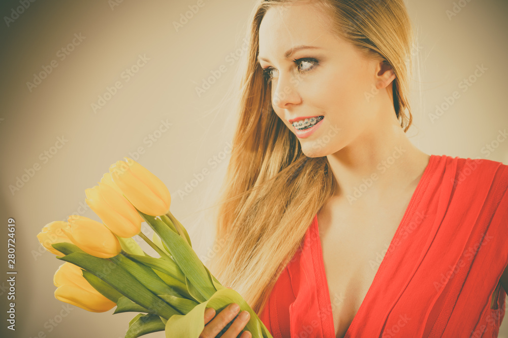 Pretty woman with yellow tulips bunch Pretty woman with yellow tulips bunch