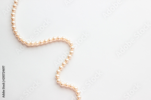 Pearls on white background photo