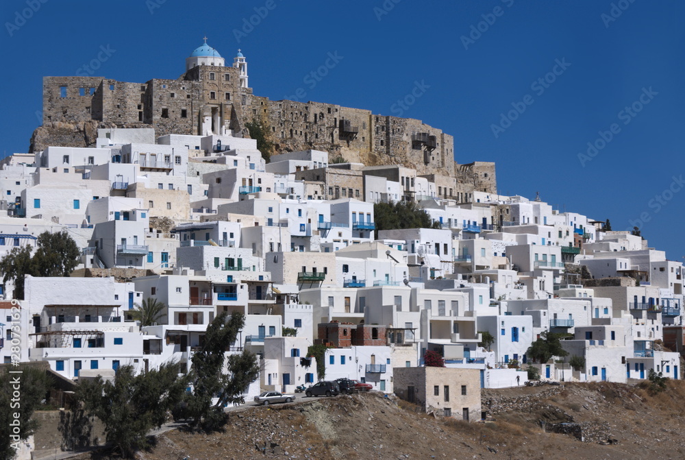 Greece, the island of Astypalaia and its castle.  Whitewashed buildings cluster around the venerable and historic Querini fortress.